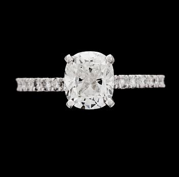 205. RING, cushion cut diamond, 1.55 cts, and brilliant cut diamonds, tot. app. 0.35 cts.