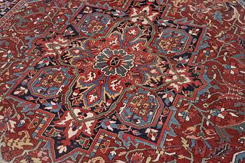 An Antique Heriz carpet, North west persia, c. 380 x 310 cm.