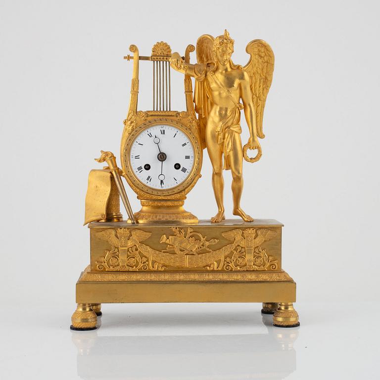 A French Empire ormolu figural mantel clock, early 19th century.