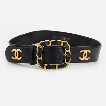 Chanel, a black caviar letaher and gold tone metal belt.