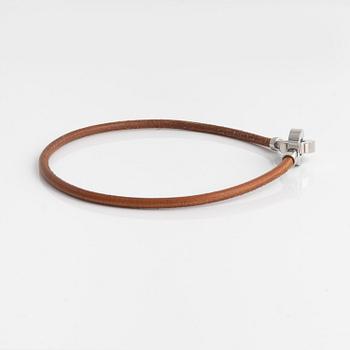 Hermès, a leather and palladium choker necklace.