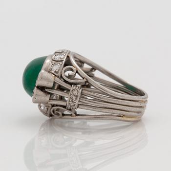 A cabochon cut emerald and brilliant cut diamond ring. Total carat weight circa 0.90 ct.