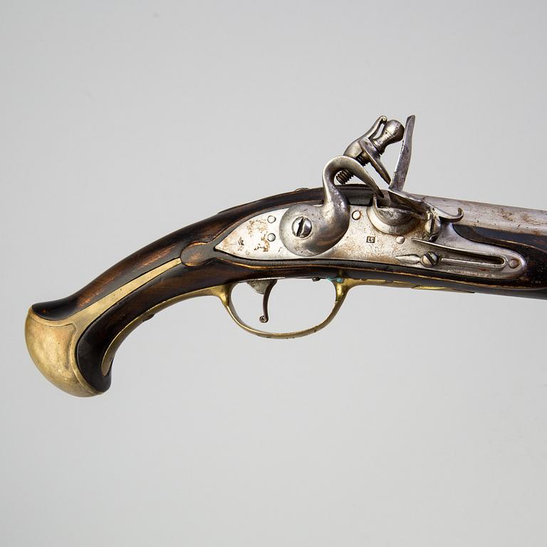 A 18th century flintlock pistol.