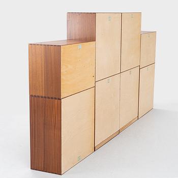 Mogens Koch, a pair of cabinets and six modules, 'Byggereolen', Rud Rasmussens Snedkerier, Denmark, mid 20th Century.