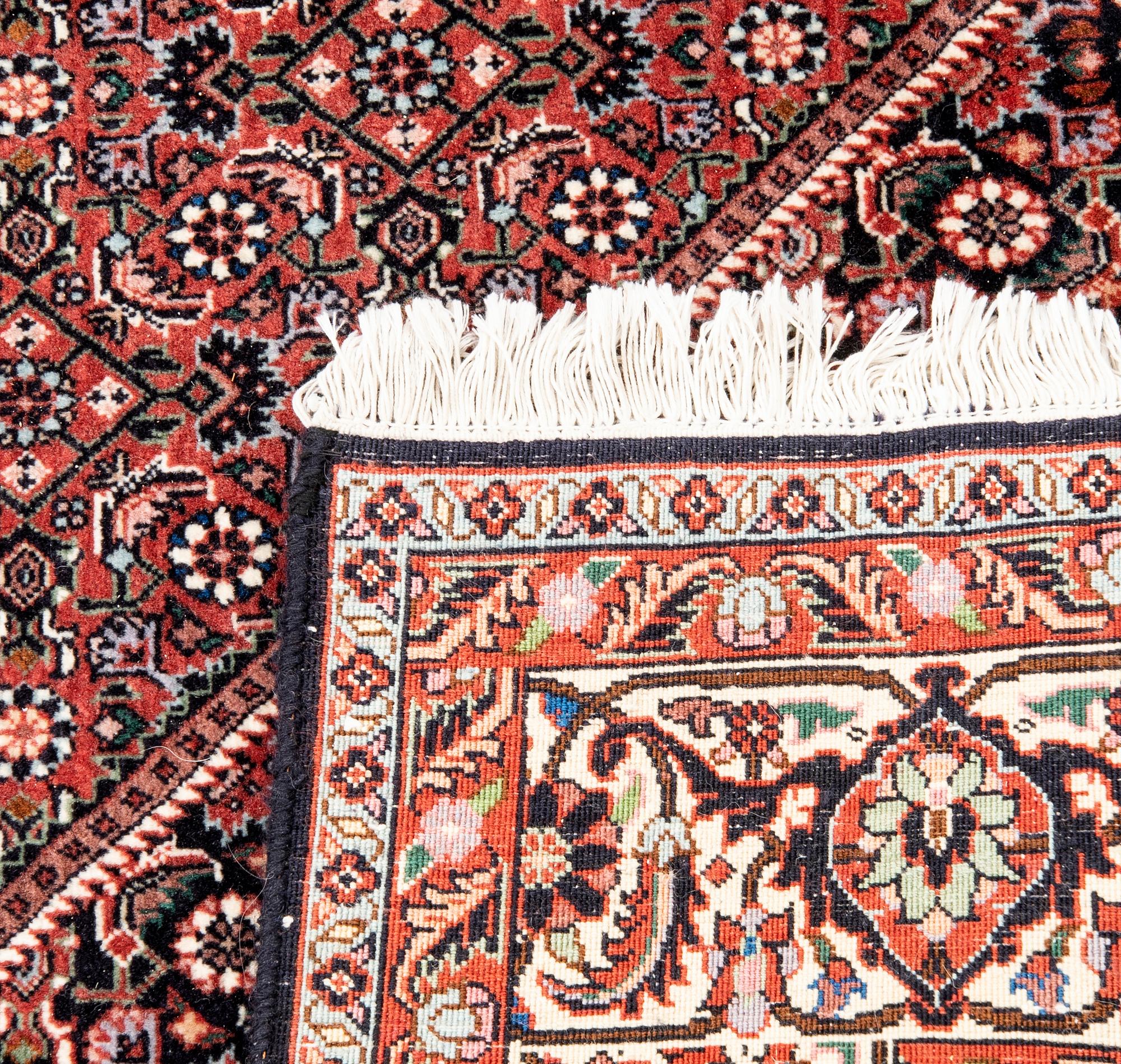 An old Bidjar carpet approx 240x174 cm.