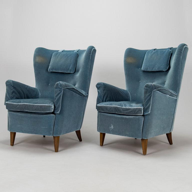 A pair of mid-20th century armchairs.