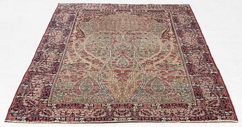 An antique Kirman rug, south Persia, c. 220 x 140 cm.