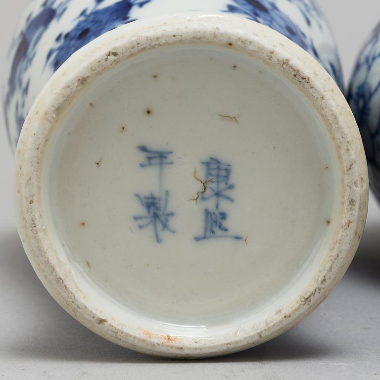 Three (2+1) blue and white porcelain vases, Qing dynasty, late 19th century.