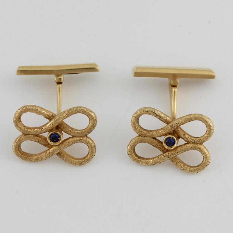 MANSCHETTKNAPPAR, ett par, 18k guld med små safirer. Vikt ca 9 gram.