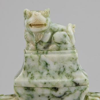 A carved green stone vase with cover, China, 20th Century.