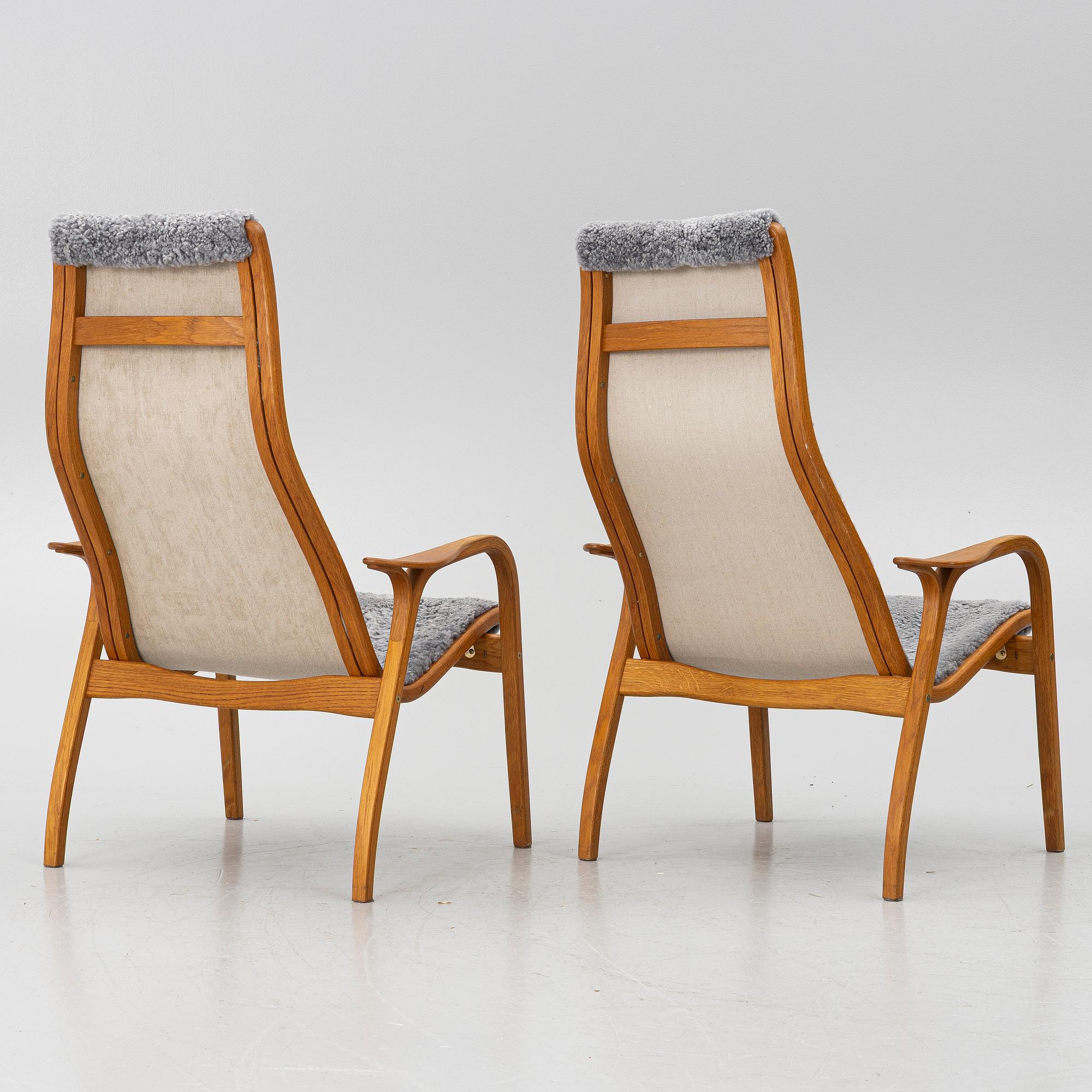 Yngve Ekström, A pair of armchairs, a footstool, “Lamino”, and a side table, Swedese, 2000s.