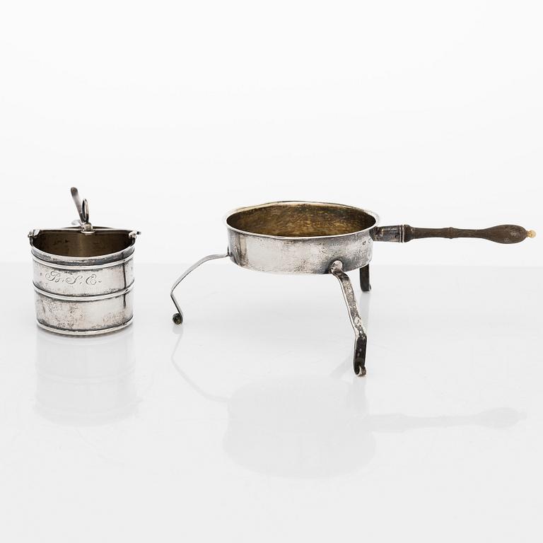 A silver sugar bowl, R. Mellin, Helsinki 1860, and two tea strainers, Kuopio and Porvoo, first half of the 19th century.
