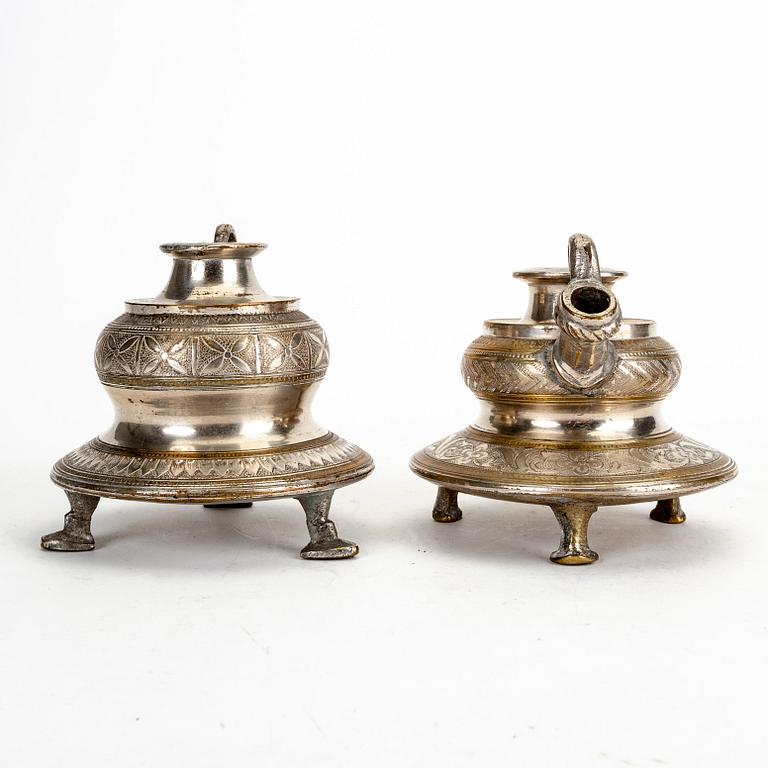 A pair of metall candle holders, India, 20th Century.