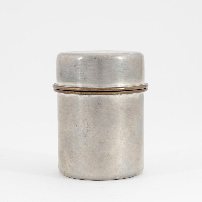 Estrid Ericson, A pewter and brass jar with cover, Firma Svenskt Tenn, Stockholm, 1957.