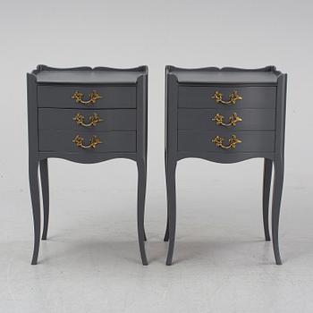 A pair of rococo style bedside tables.