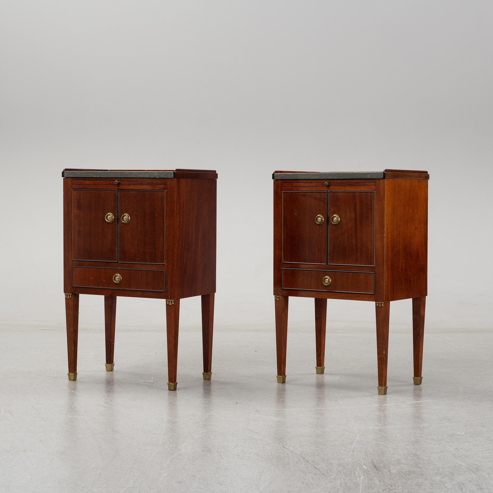 A pair of mahgany veneered bedside cabinets, early 20th Century.