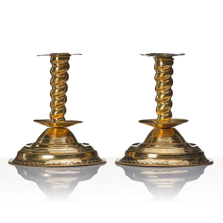 A pair of late Baroque candlesticks.