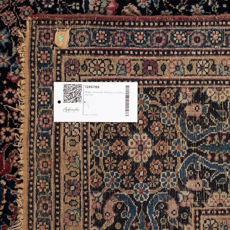 A carpet, a semi-antique Tehran, possibly, ca 220 x 142 cm.