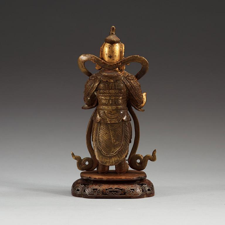 A gilt bronze figure of a Lokapala, Qing dynasty, 19th Century.