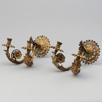 A pair of metal wall scones, around 1900.