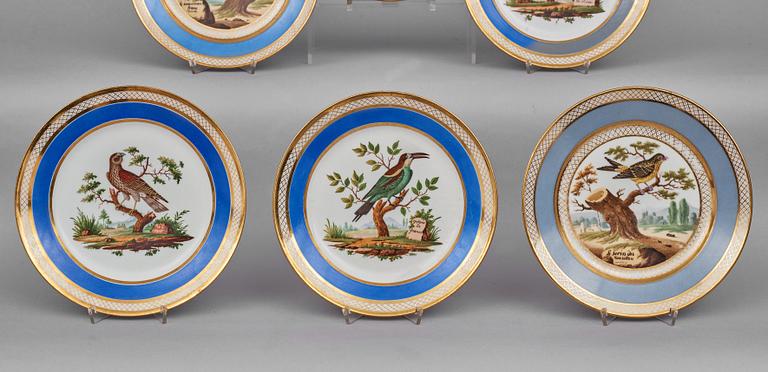 A set of 10 French ornitological dessert plates, signed Schoelber, 19th Century. (8+2).