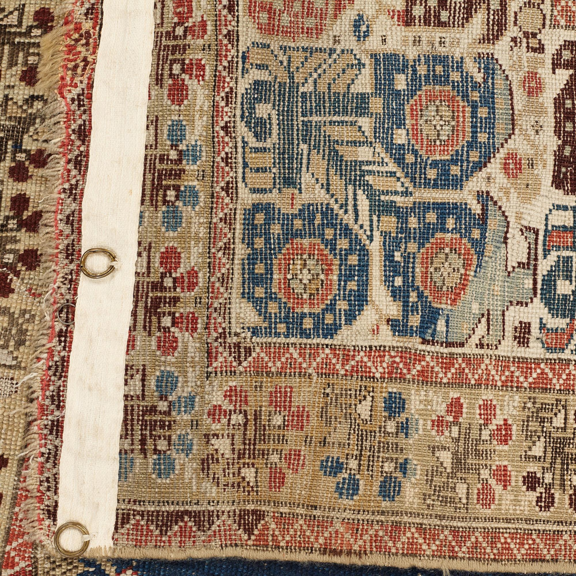 A RUG, an antique Gördes (Ghiordes) prayer rug, second half of the 18th century, ca 167-170 x 120-123 cm.