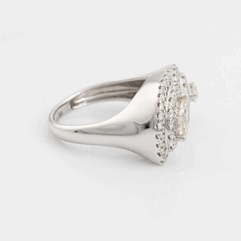 Ring with marquise and brilliant cut diamonds.