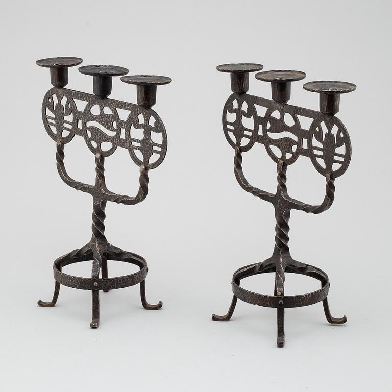 A pair of 1920s/1930s iron candelabres.