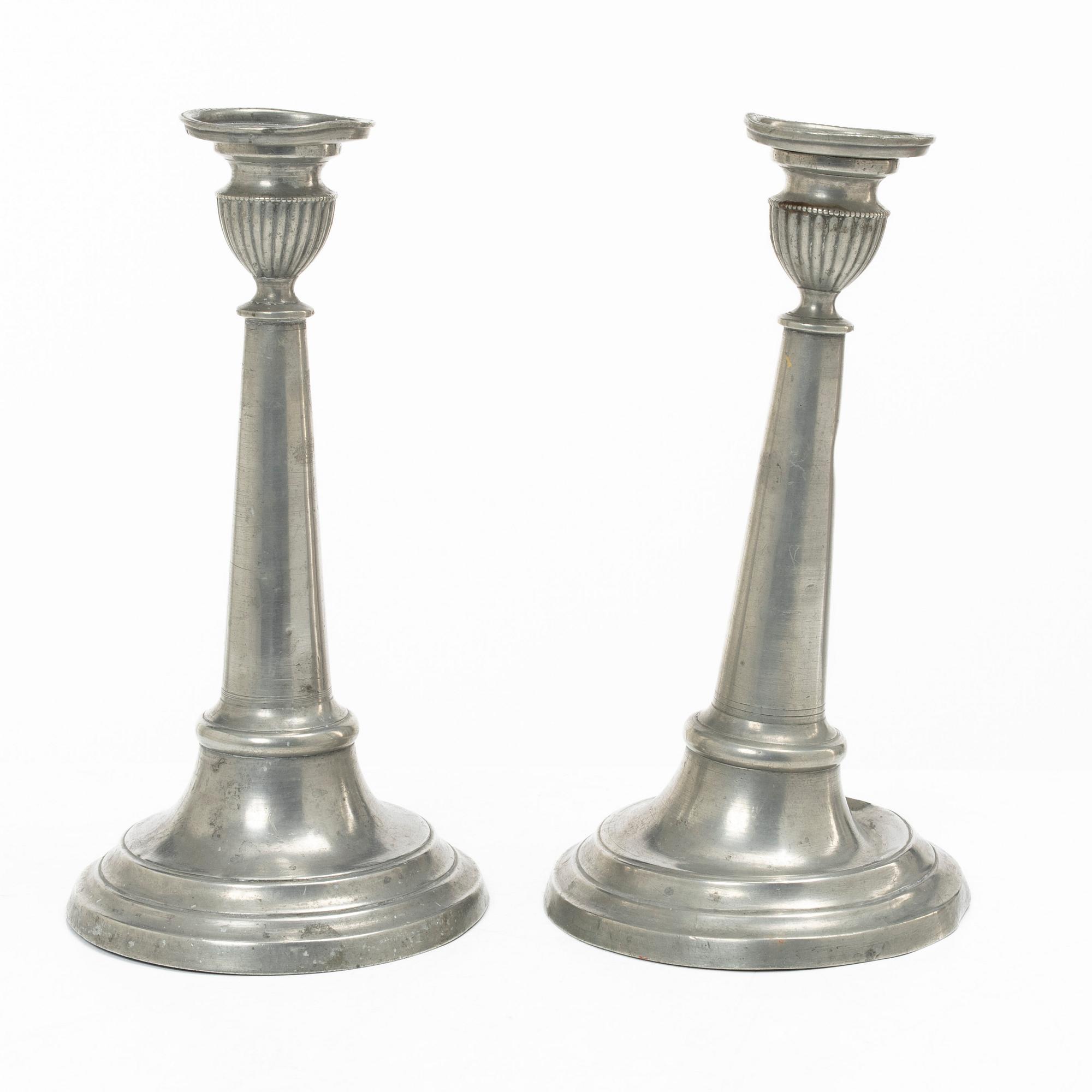 A pair of pewter candle sticks, Sweden, possibly 1844.