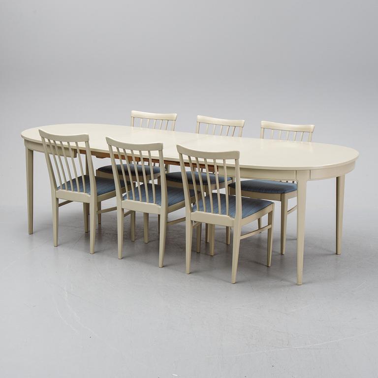 A dining table with six chairs by Carl Malmsten, second half of the 20th Century.
