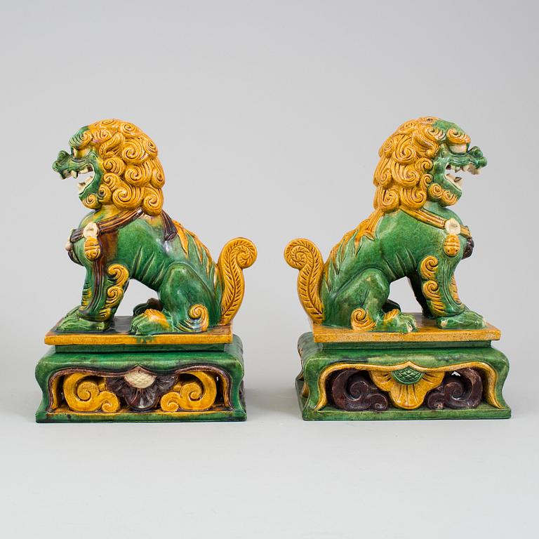 A pair of buddhist lion sculptures. 20th century.