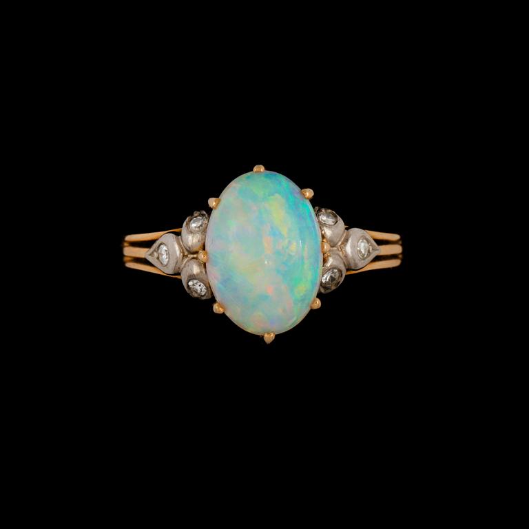 RING, 18k guld, cabochonslipad genuin opal och 6 åttkantslipade diamanter, Hallbergs, Stockholm, 1959. Vikt 4 g.