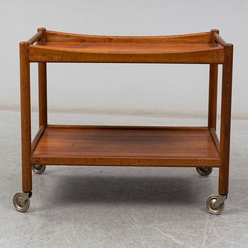 A signed tea trolley by Hans J Wegner for Andreas Tuck, Denmark, mid 20th century.