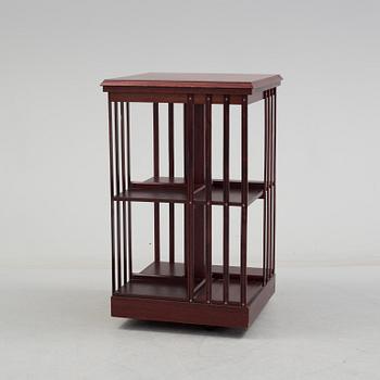 An second half of the 20th century turning book shelf veneered with mahogny.
