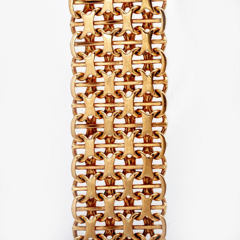 An 18K gold bracelet, 1975.