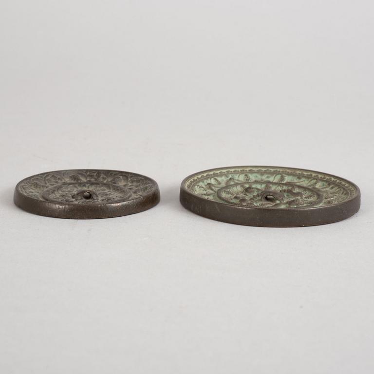 Two bronze mirrors, Tang dynasty (618-907).