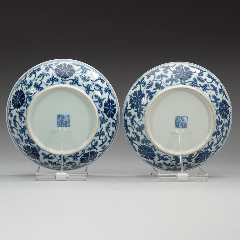 A pair of blue and white lotus dishes, Qing dynasty with Qianlong seal mark.