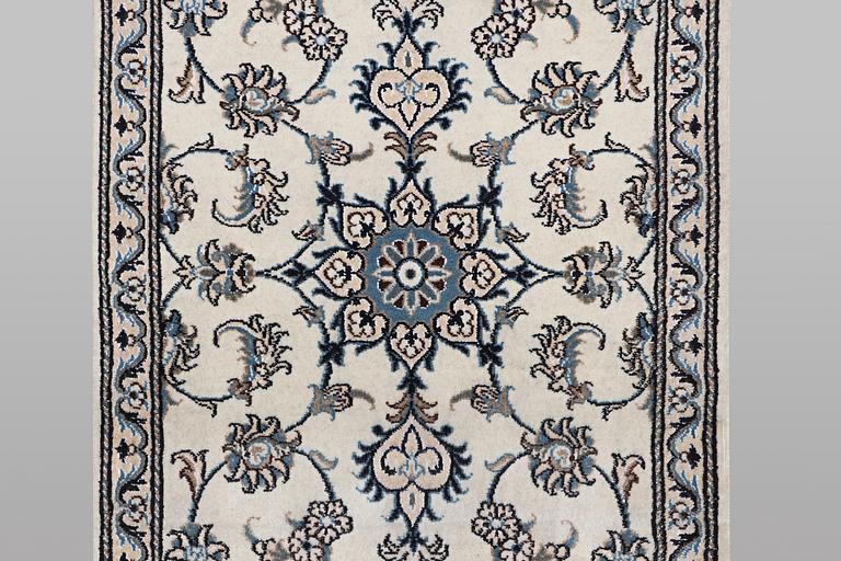 A runner carpet, Nain, part silk, ca 197 x 77 cm.