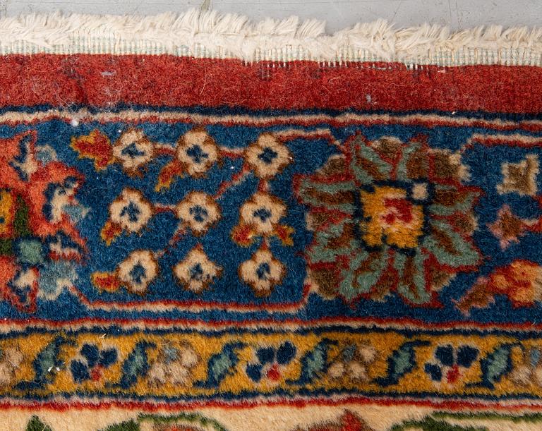 A carpet, a semi-antique Tabriz, ca 528-535 x 346,5-352,5 cm, signed Farhan.