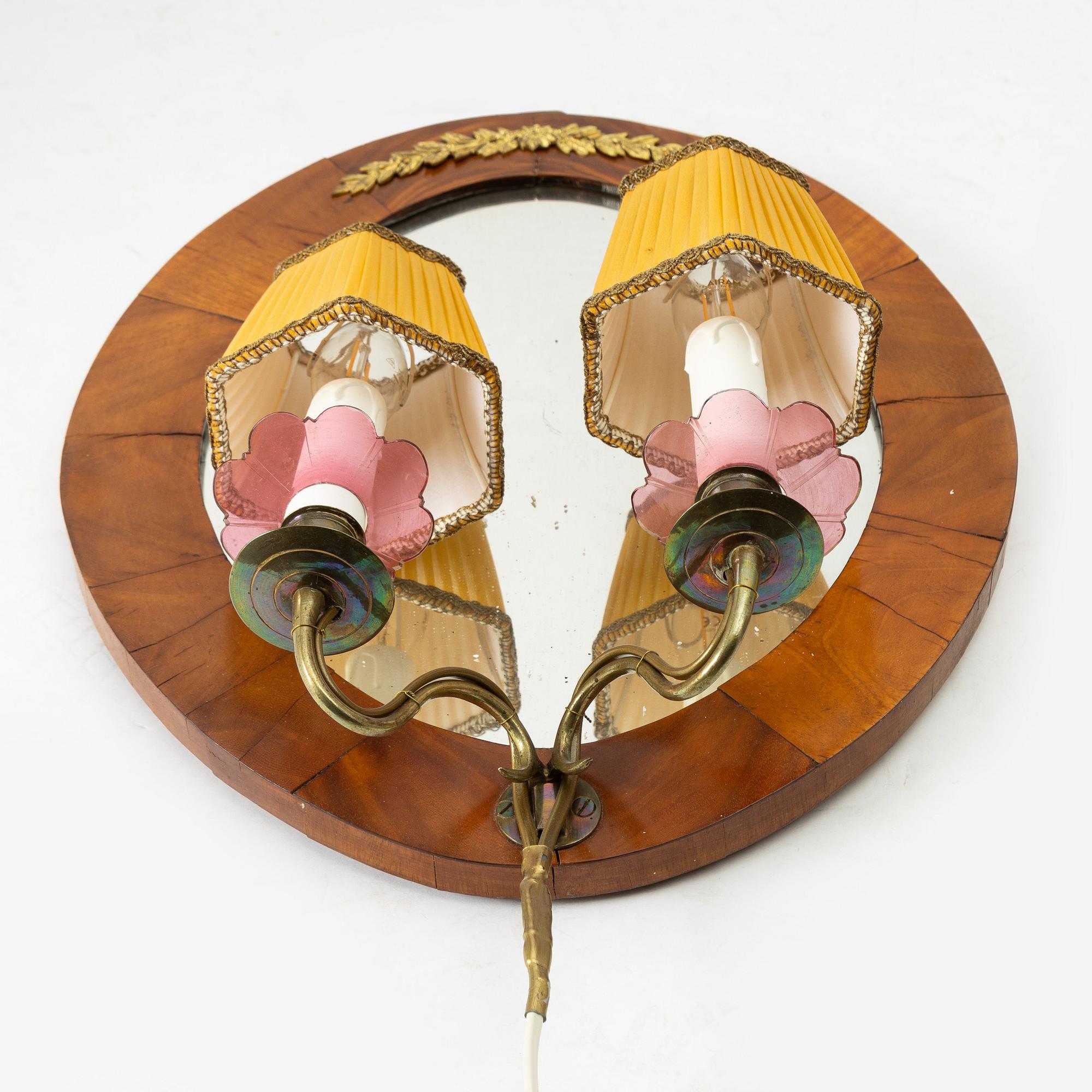 A pair of Swedish Empire mirror sconces, first half of the 19th century.