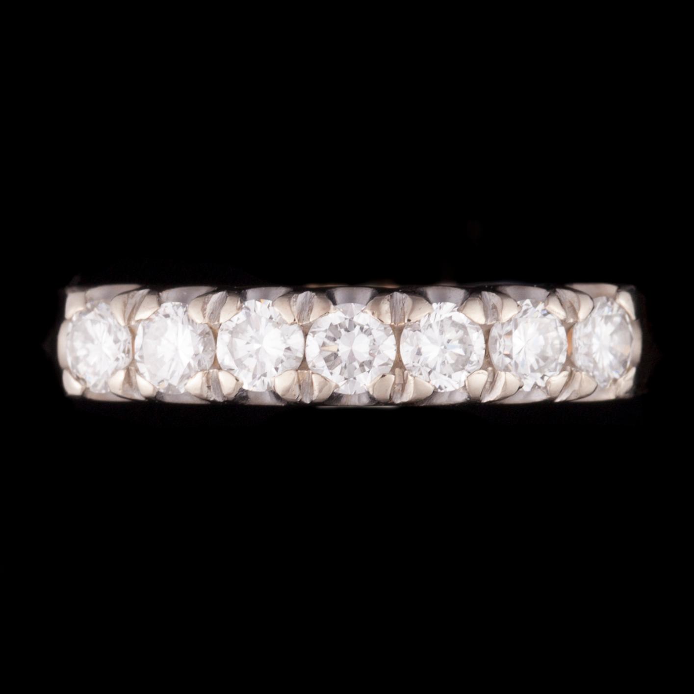 ALLIANSRING, 14K guld, 7 briljantslipade diamanter tot. 0,63 ct, kontrollstämpel 1987. Vikt 3,2 g.