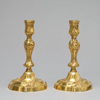 A pair of Louis XV-style candlesticks, circa 1900.