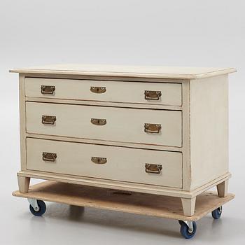 A chest of drawers, circa 1900.