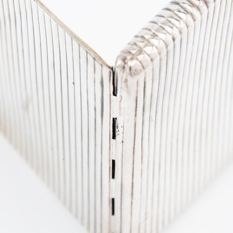 Cigarette case of silver with a cabochon-cut blue stone, first half of the 20th century.