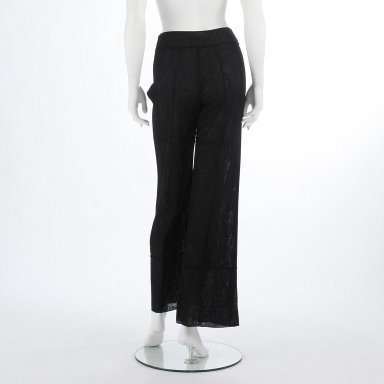 CHANEL, a black mesh evening pant.