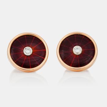 772. A pair of cufflinks, red enamel and brilliant cut diamond.