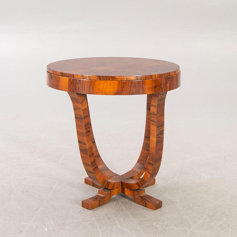 An Art Deco walnut coffee table first half of the 20th century.