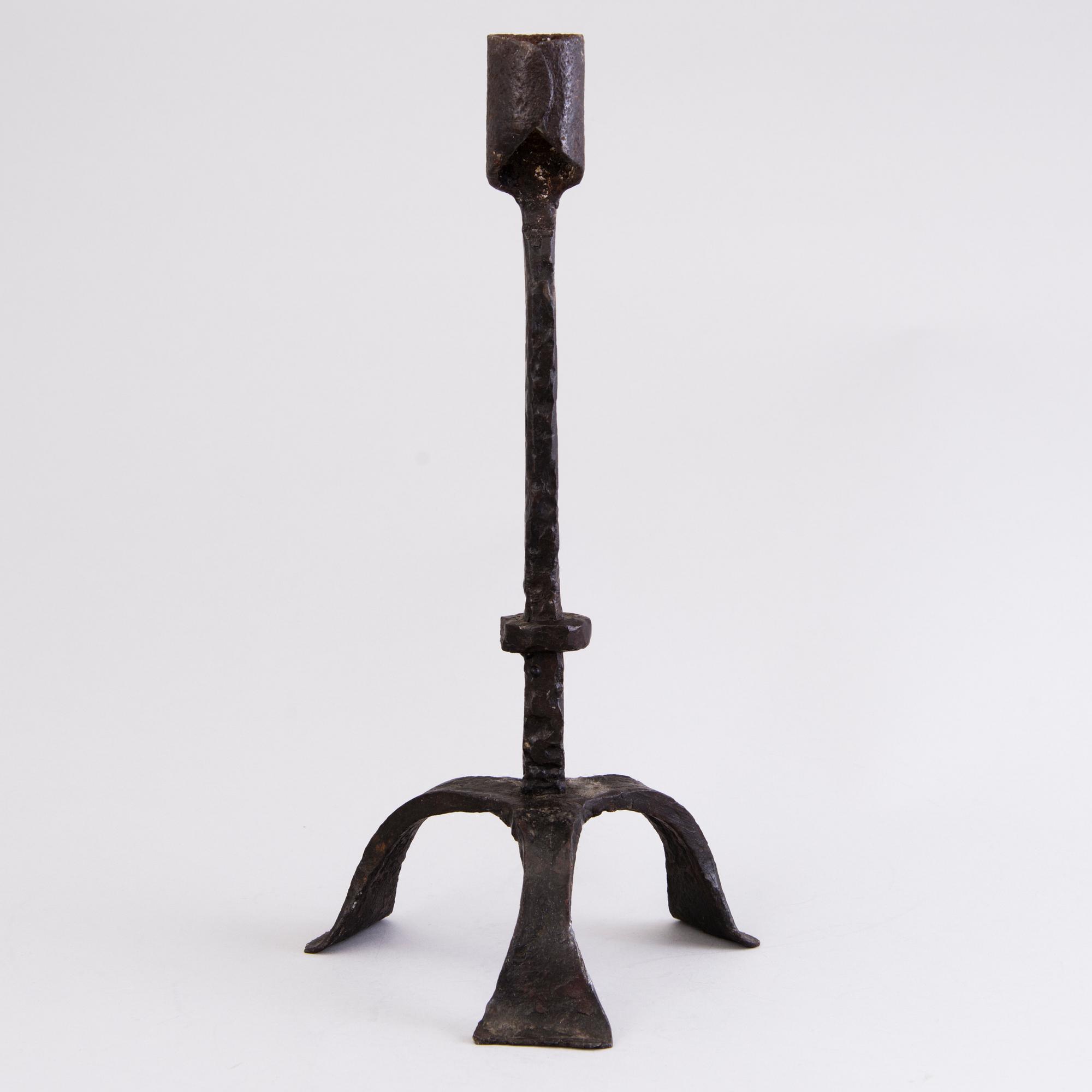 A CANDLESTICK, iron, 18th century or older.
