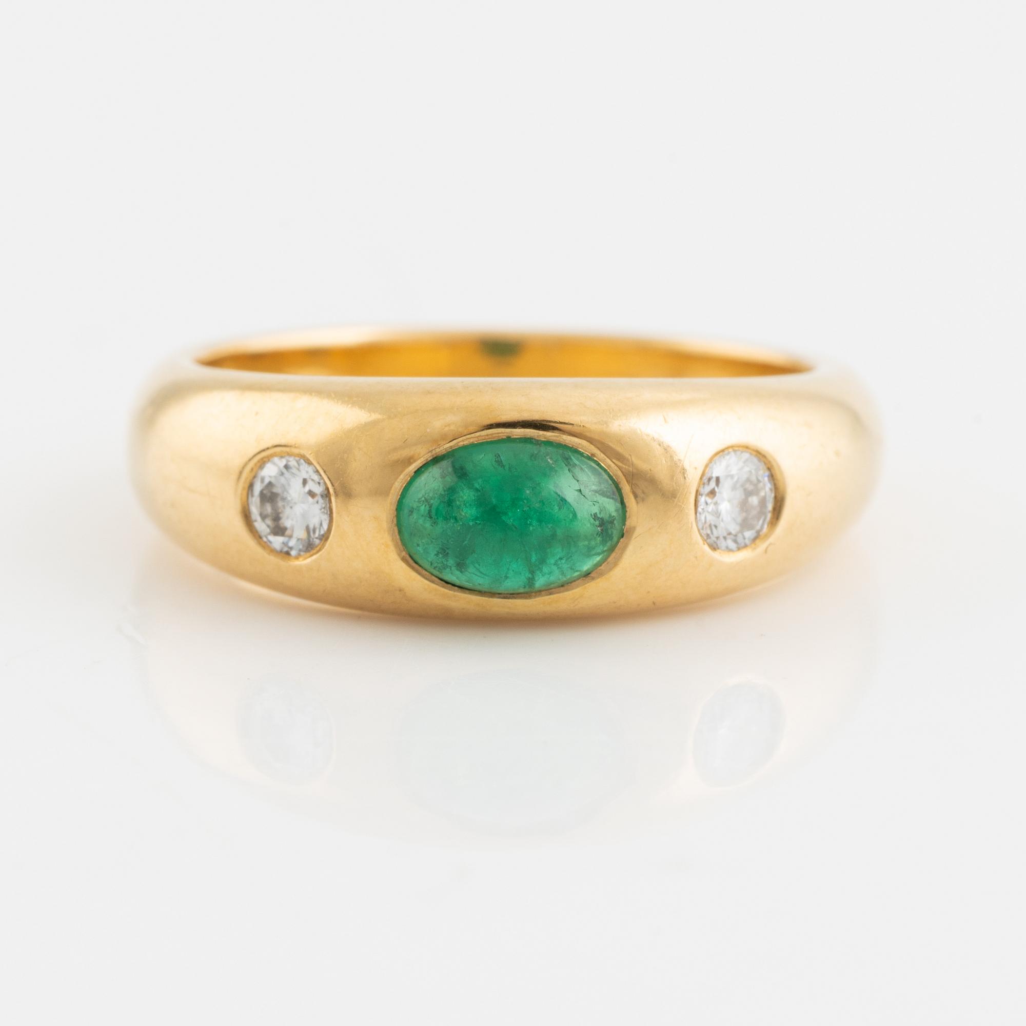 Cabochon cut emerald and brilliant cut diamond ring.