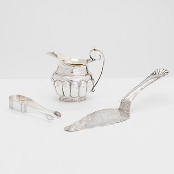 Cream jug, cake server, and sugar tongs in silver, Finland from latter part of the 18th century to 1854.
